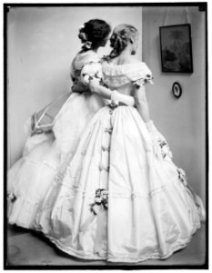 The silhouette, a study posed by the Gerson sisters in their Crinoline Ball costumes LCCN2006684237