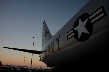 The sun rises on a U.S. Navy P-8A Poseidon aircraft attached to Patrol Squadron (VP) 16 before a mission in Perth, Australia, April 2, 2014 140402-N-VD564-008