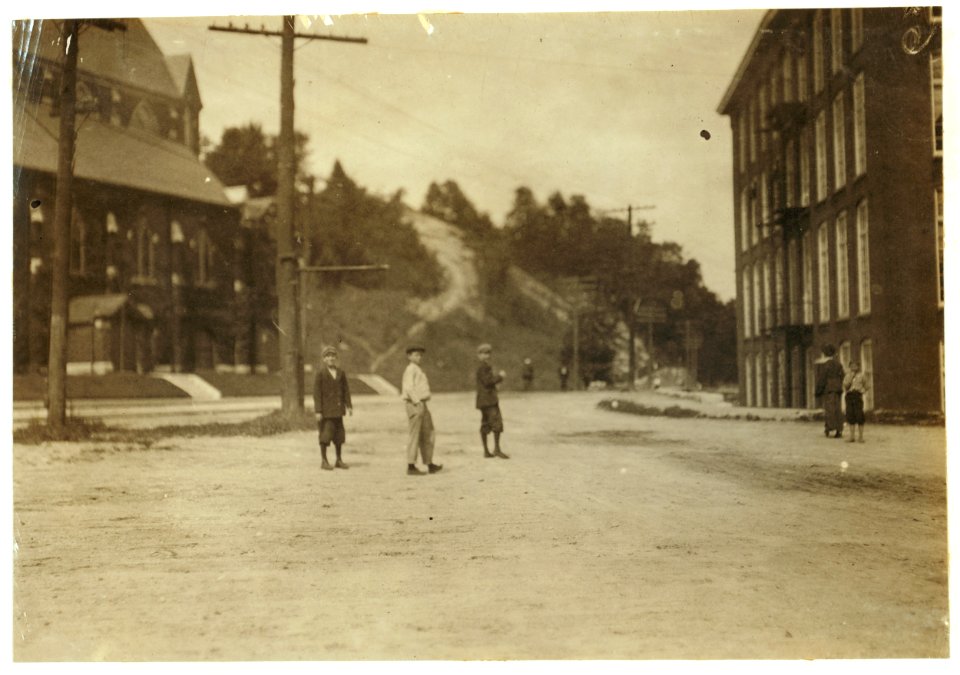 The three boys in centre want to work in Berkshire Mills, at noon, Aug. 30, '11. On August 29 at 6 P.M., Mr. Hine counted ten apparently under 14. LOC nclc.02274