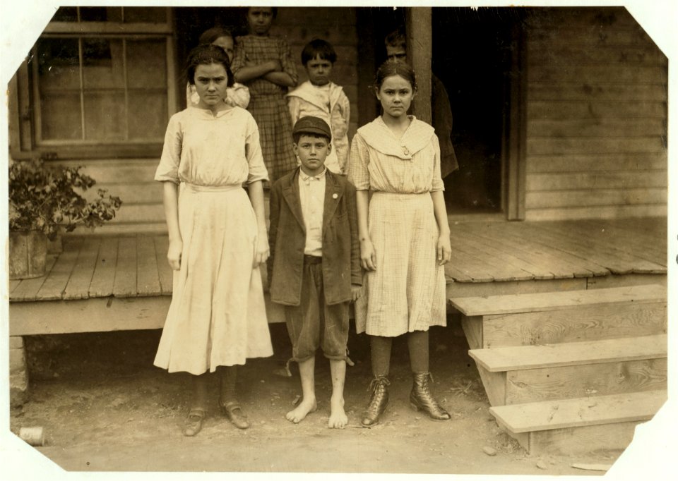 The three on the ground work in the Cannon Mills, Concord, N.C. The boy 'Otie Honeycott' (his mother could not spell his name) said he had been doffing two years in the Cannon Mill. LOC nclc.02649