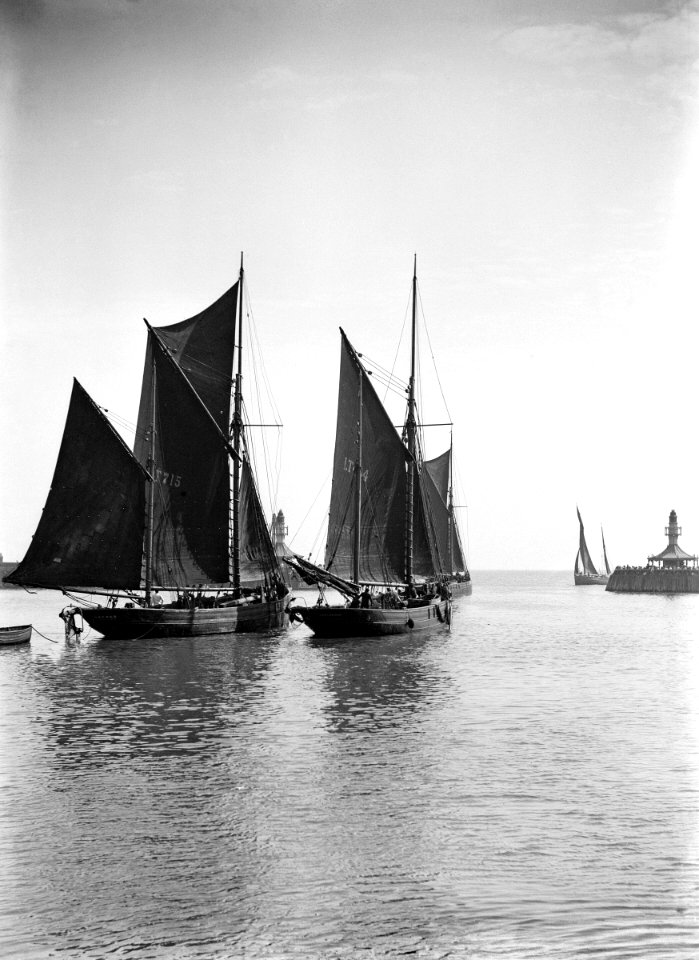 The trawler 'Refuge' (1896) (LT715) under sail, close to the trawler 'Greyhound' (1905) (LT404), in the outer harbour outward bound. RMG P27511