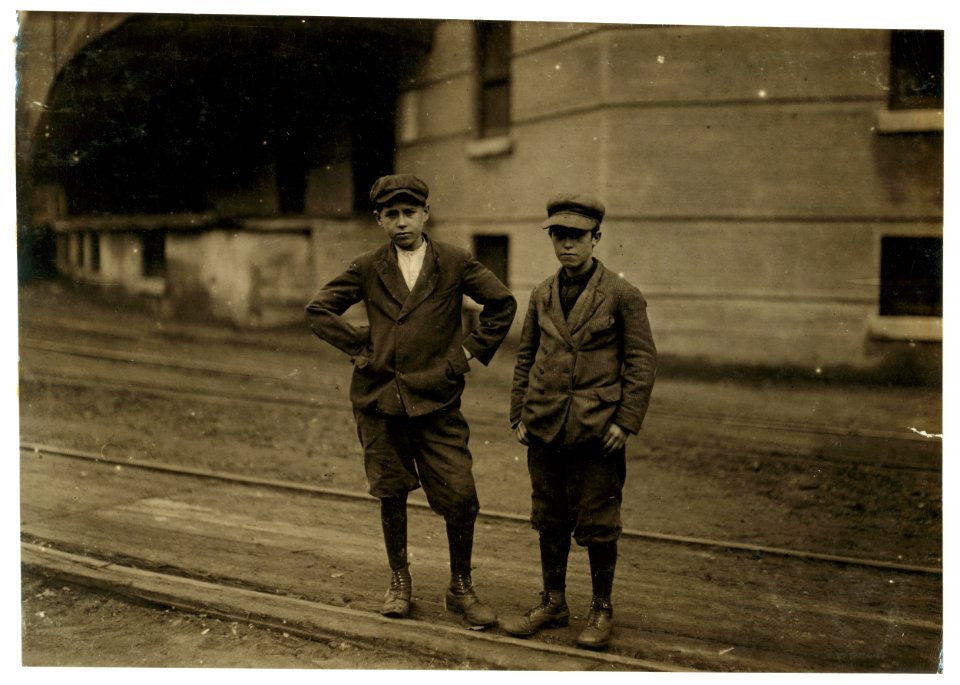 The two smallest boys in the group are Patrick Roddy, 968 Central Street, who doffs in No. 1 spinning room, and has been working there three months. Walter McNally, 7 North Street, works in LOC cph.3b43669