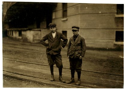 The two smallest boys in the group are Patrick Roddy, 968 Central Street, who doffs in No. 1 spinning room, and has been working there three months. Walter McNally, 7 North Street, works in LOC cph.3b43669 photo