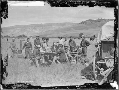 The U.S. Geological Survey in camp at Red Buttes. Figures are 1. F.V. Hayden, U.S. Geologist in Charge, 2. James... - NARA - 516891