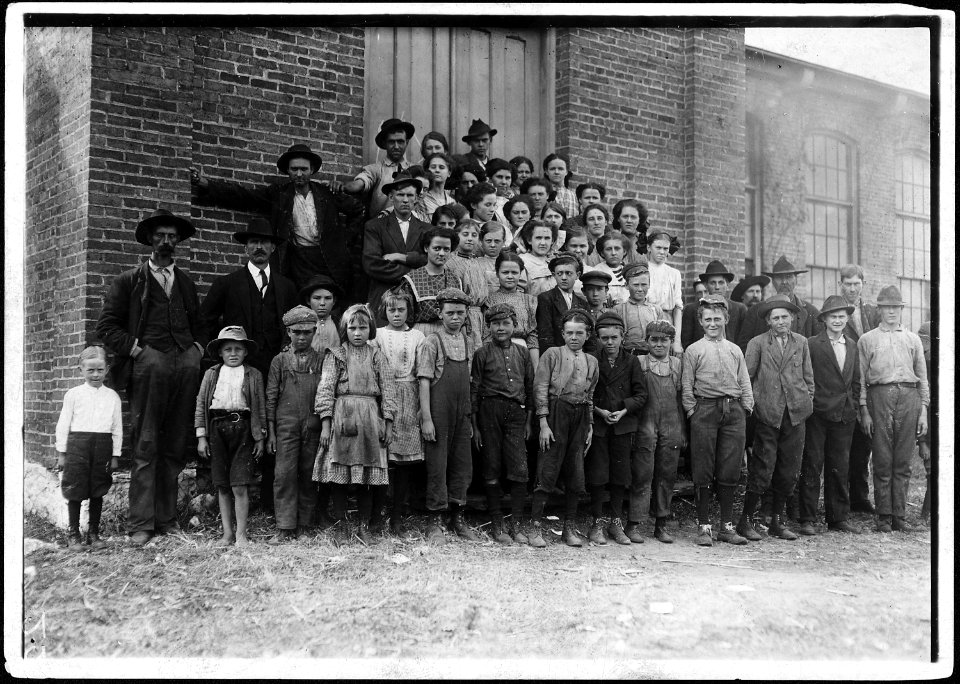 The whole force in Elk Cotton Mills. Tiny boy in white waist on extreme left, Just helps mother. The supt. Said... - NARA - 523349