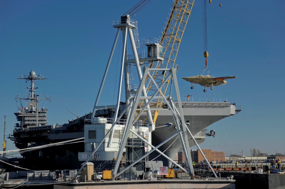 The X-47B Unmanned Combat Air System demonstrator is loaded onto USS Harry S. Truman. (8224462192)