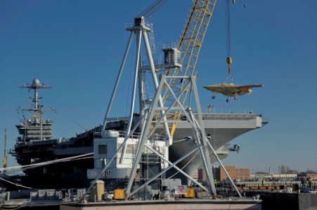 The X-47B Unmanned Combat Air System demonstrator is loaded onto USS Harry S. Truman. (8224462192)
