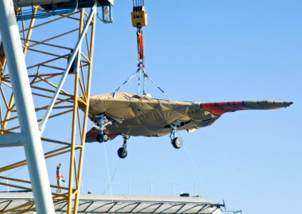 The X-47B Unmanned Combat Air System demonstrator is loaded onto USS Harry S. Truman. (8223389233)