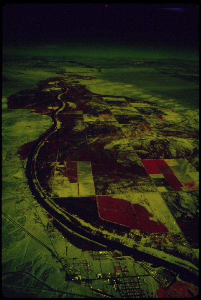 The-colorado-river-feeds-crops-and-vegetation-dark-areas--town-of-needles-in-foreground-may-1972 7136554839 o