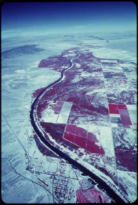 The-colorado-river-feeds-crops-and-vegetation-dark-areas--town-of-needles-in-foreground-may-1972 7136547335 o