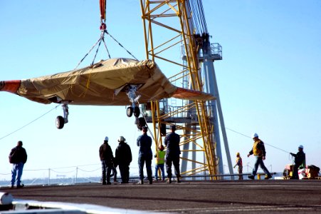 The X-47B Unmanned Combat Air System demonstrator is loaded onto USS Harry S. Truman. (8223387407)