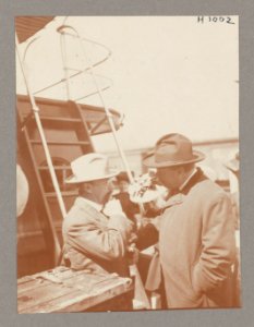 Theodore Roosevelt conversing with a man on deck of ship LCCN2013650588 photo