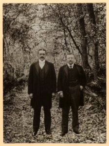 Theodore Roosevelt and a man standing in a wooded area, full length, group portrait LCCN2013650593
