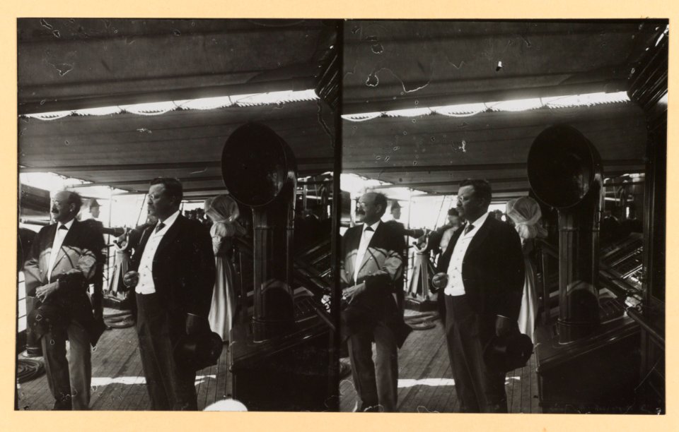 Theodore Roosevelt on deck of ship with another man, facing left LCCN2013650586