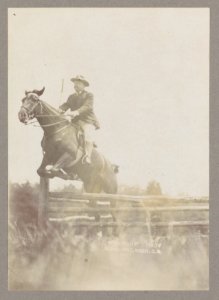 Theodore Roosevelt on horseback jumping over a split rail fence LCCN2013649647 photo