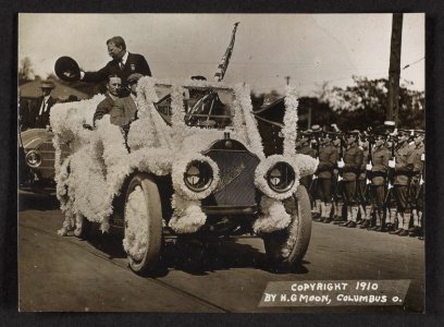 Theodore Roosevelt riding in a parade float LCCN2013651466