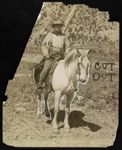 Theodore Roosevelt on horseback, holding a rifle LCCN2013651382