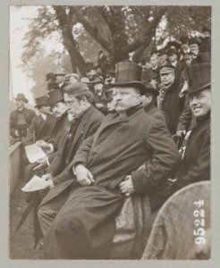 Theodore Roosevelt seated viewing parade outside LCCN2013647449