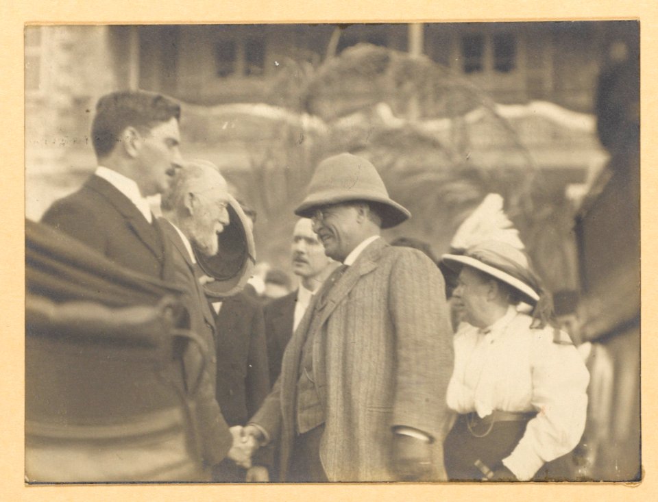 Theodore Roosevelt shaking hands with an elderly man LCCN2013651050