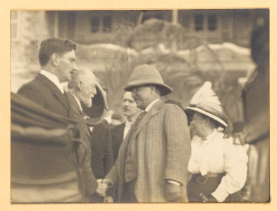 Theodore Roosevelt shaking hands with an elderly man LCCN2013651050