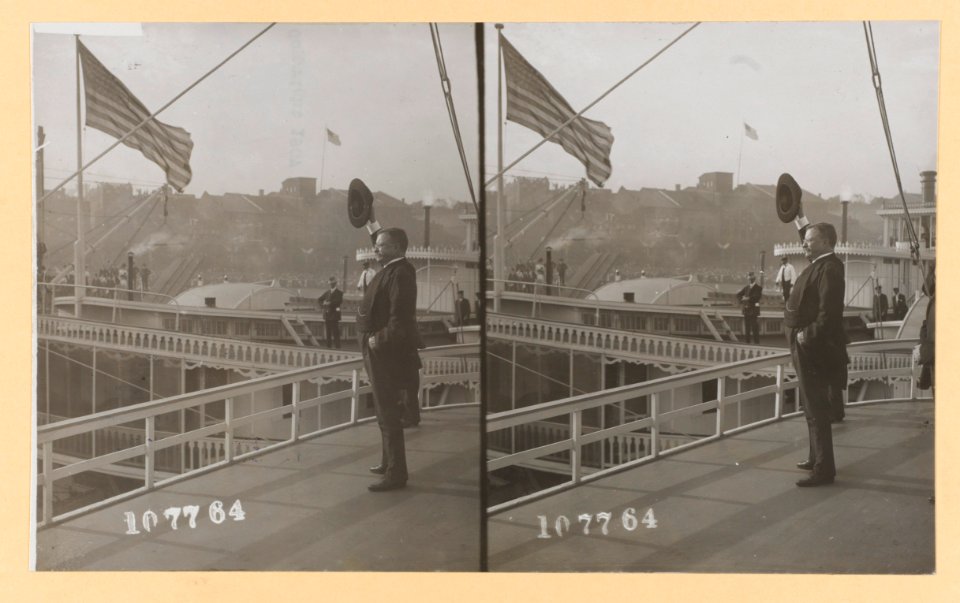 Theodore Roosevelt standing on deck of a ship waving with a hat LCCN2013650570