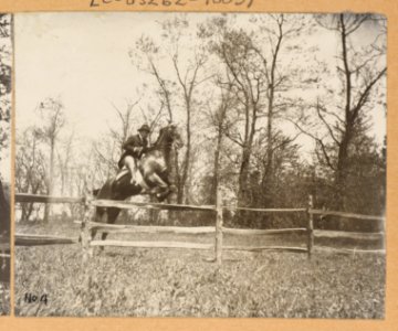 Theodore Roosevelt on horseback jumping over a split rail fence LCCN2011645287 photo