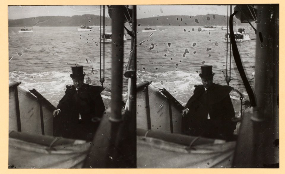 Theodore Roosevelt wearing a tall hat and cape climbs up the steps aboard a ship LCCN2013650569