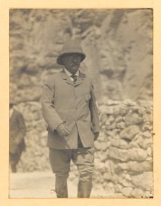 Theodore Roosevelt walking forward, wearing a pith helmet LCCN2010645471
