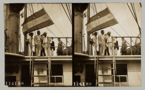 Theodore Roosevelt with group of men and boys at top of steps on a ship LCCN2013651065