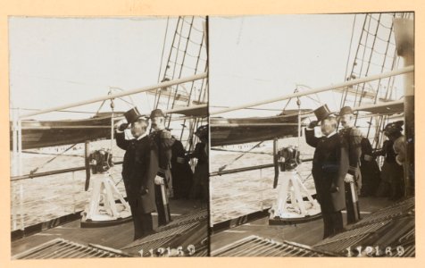 Theodore Roosevelt, full-length portrait, facing left, standing on deck of ship, with a naval officer LCCN97520210 photo