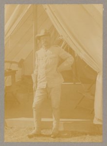 Theodore Roosevelt, full-length portrait, standing outside his tent, facing front LCCN2013651051