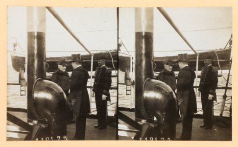 Theodore Roosevelt, back to camera, with two naval officers on deck of ship LCCN2013650582 photo