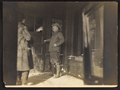 Theodore Roosevelt, full-length, standing, facing left, opening door LCCN93511244