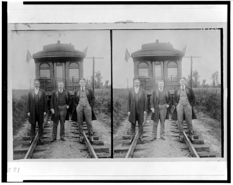 Theodore Roosevelt, full-length portrait, standing, with two other men in front of railroad observation car LCCN2002722537