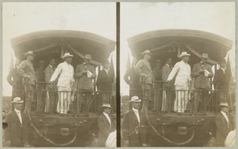 Theodore Roosevelt, standing on back of railroad car, speaking toward crowd LCCN91708855