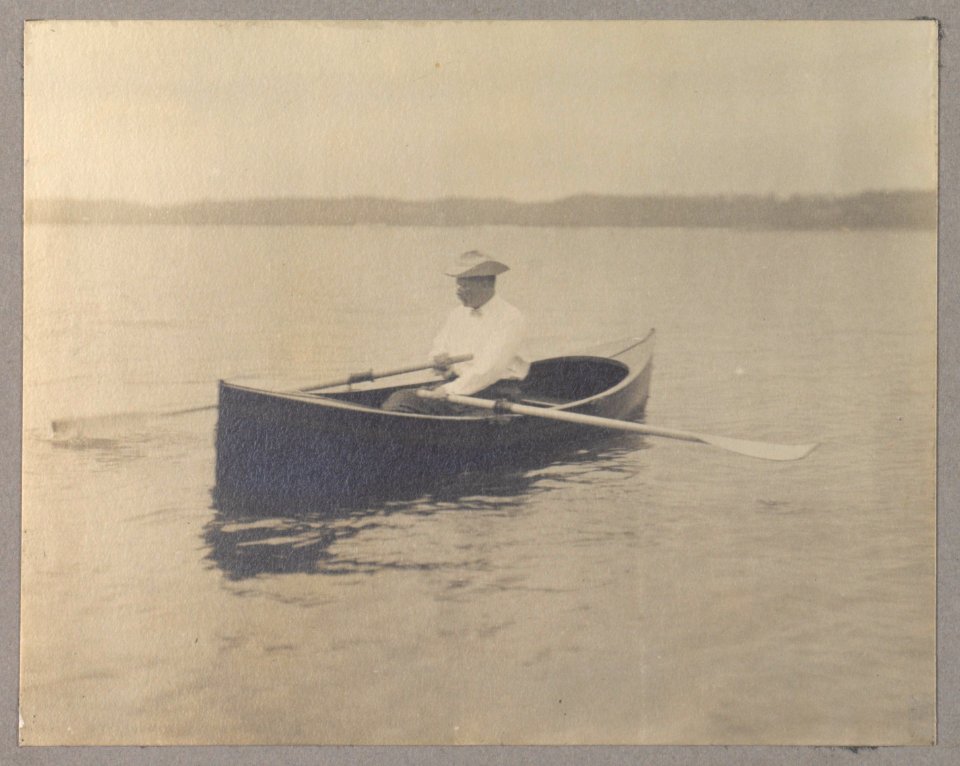 Theodore Roosevelt, seated in canoe, rowing LCCN2001697285