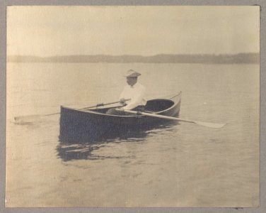 Theodore Roosevelt, seated in canoe, rowing LCCN2001697285