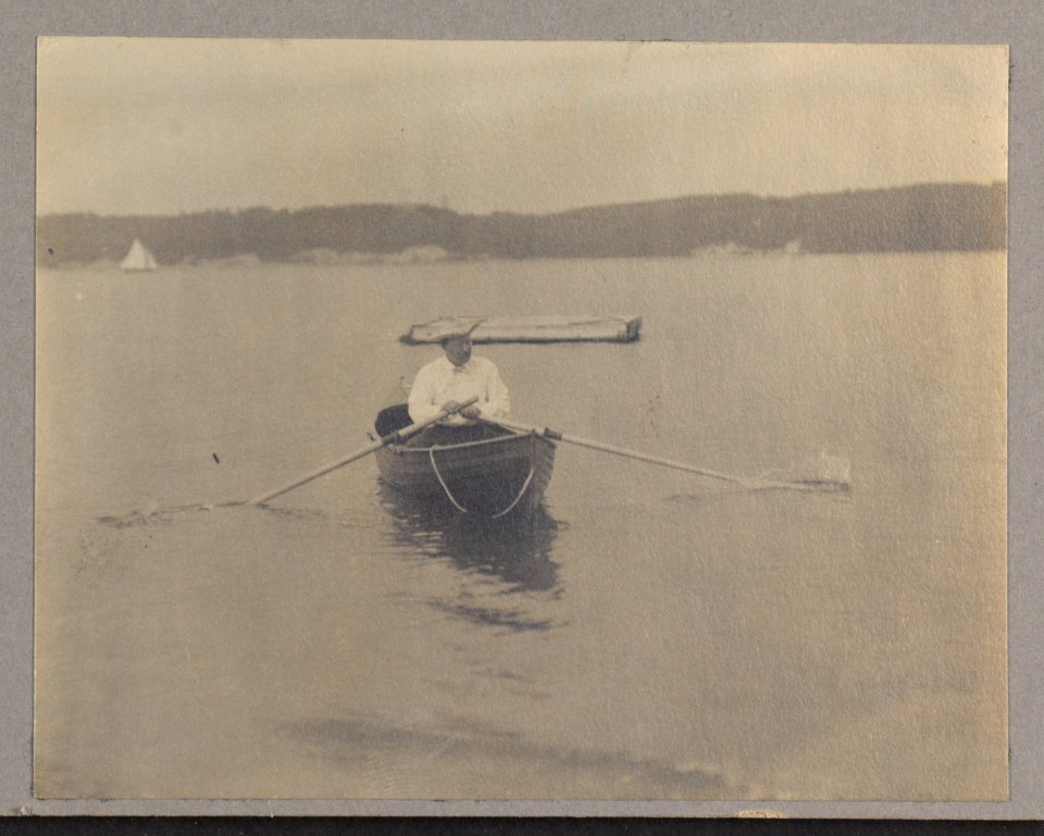 Theodore Roosevelt, seated in canoe, rowing LCCN2001697290