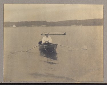 Theodore Roosevelt, seated in canoe, rowing LCCN2001697290