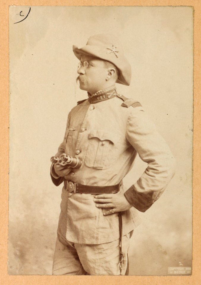 Theodore Roosevelt, three-quarter length portrait, holding a binocular, facing left LCCN2013651053