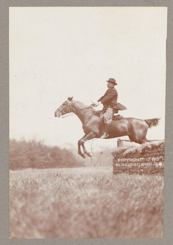 Theodore Roosevelt, side view, on horseback jumping over stone wall LCCN2013649646