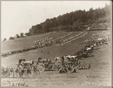 Third Battalion 13th Regiment Heavy Field Artillery, Fourth Division, in rest camp on hillside near Andelot. 155-mm. guns can be seen in the foreground almost hidden by camouflage and LCCN2013649099