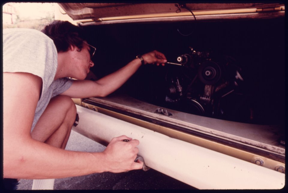 This Driver Is Adjusting the Carburetor of His Van at a Service Station after His Vehicle Failed the Carbon Monoxide Test at an Auto Emission Inspection Station in Downtown Cincinnati, Ohio...08-1975 (4266541734)