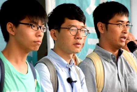 香港眾志秘書長黃之鋒，香港眾志主席羅冠聰，前學聯秘書長周永康