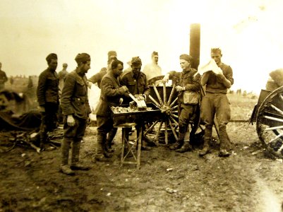 “Canned Bill,” D, 6th Infantry, 5th Division cutting up canned corn beef, France, 1918 (30587929566) photo