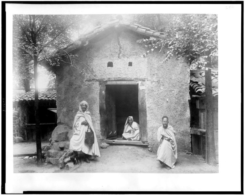 Three Arab men sitting in front of Kabyle house, Paris Exposition, 1889 LCCN94500794