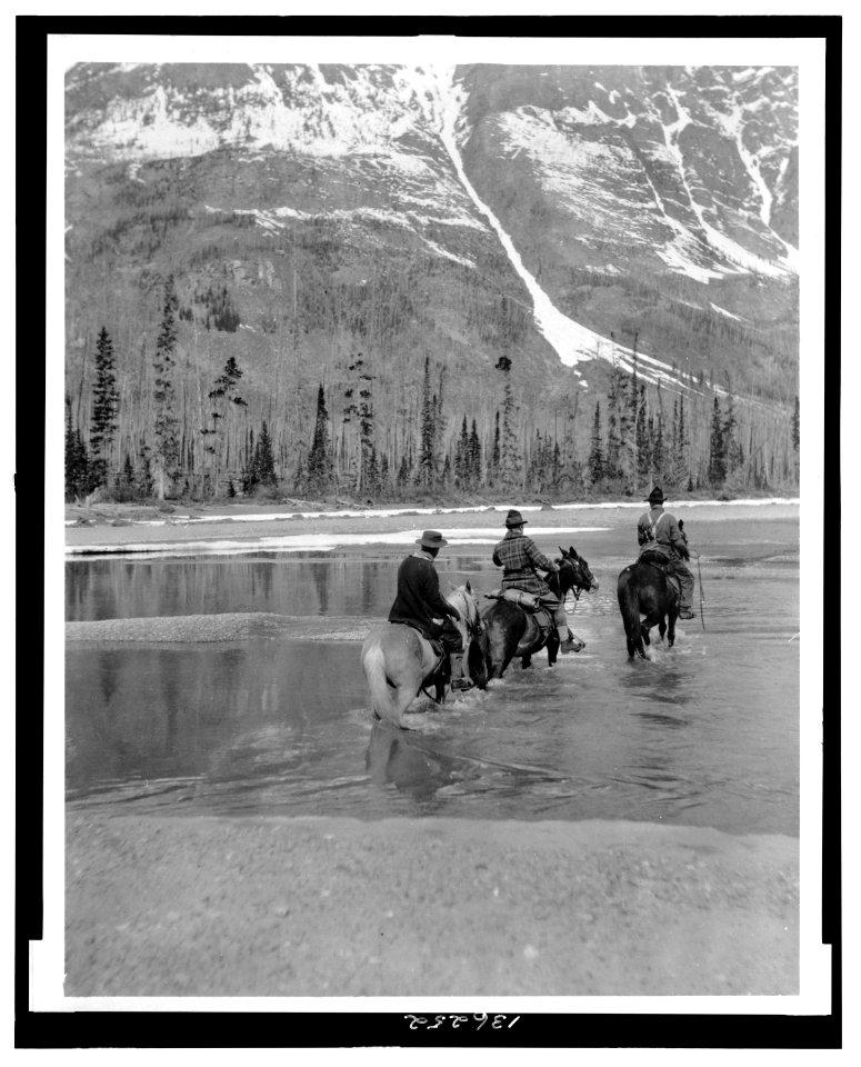 Three campers on horseback cross the Columbia River in Washington LCCN2006676007