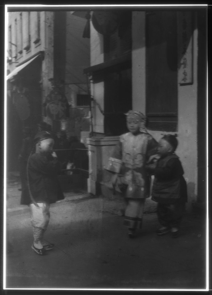 Three children standing on a sidewalk, Chinatown, San Francisco LOC agc.7a55036