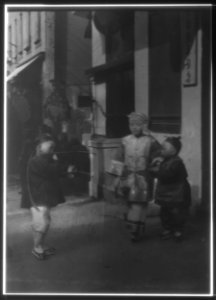 Three children standing on a sidewalk, Chinatown, San Francisco LOC agc.7a55036