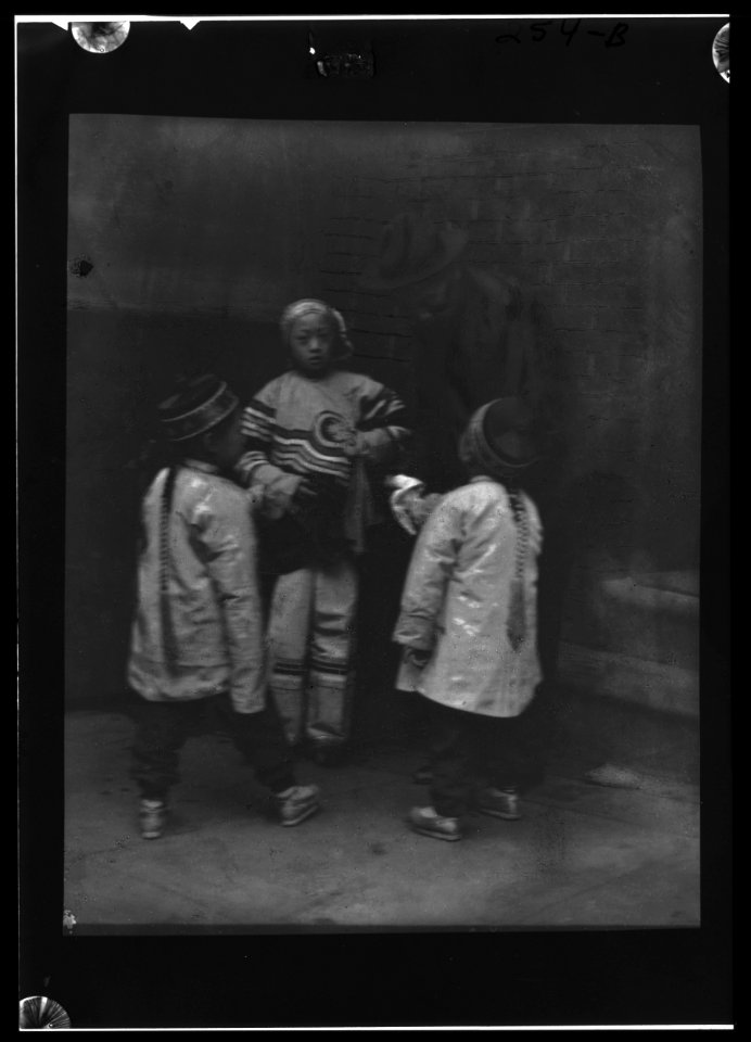 Three children talking to a man, Chinatown, San Francisco LOC agc.7a55047